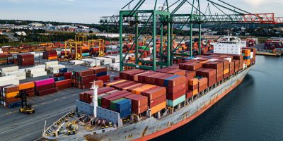 Less than Container Load LCL shipping containers being loaded