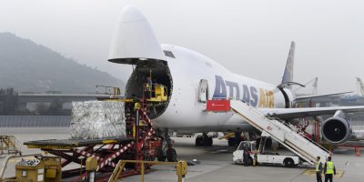 Shipment of perishable goods and high value cargo being handled with care by logistics professionals