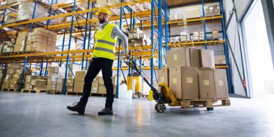 Modern warehouse interior showing organized shelves and boxes, representing Warehousing and Distribution 3PL services.
